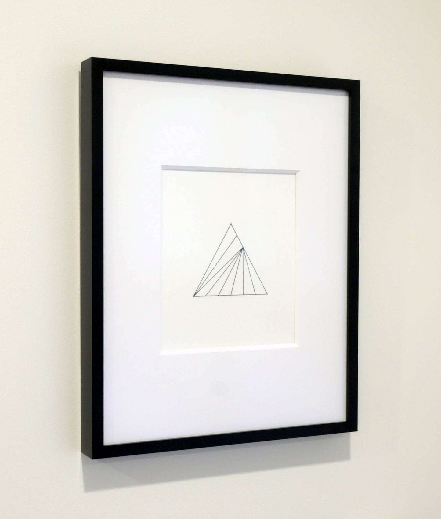 minimalist drawing framed on the wall