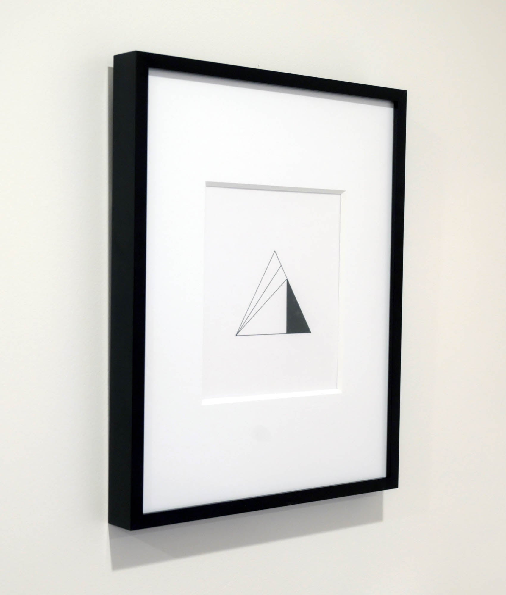 artwork framed on a white wall